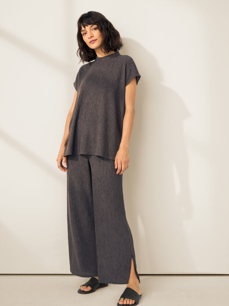 Woman wearing EILEEN FISHER matching set. Woman wearing EILEEN FISHER matching set.