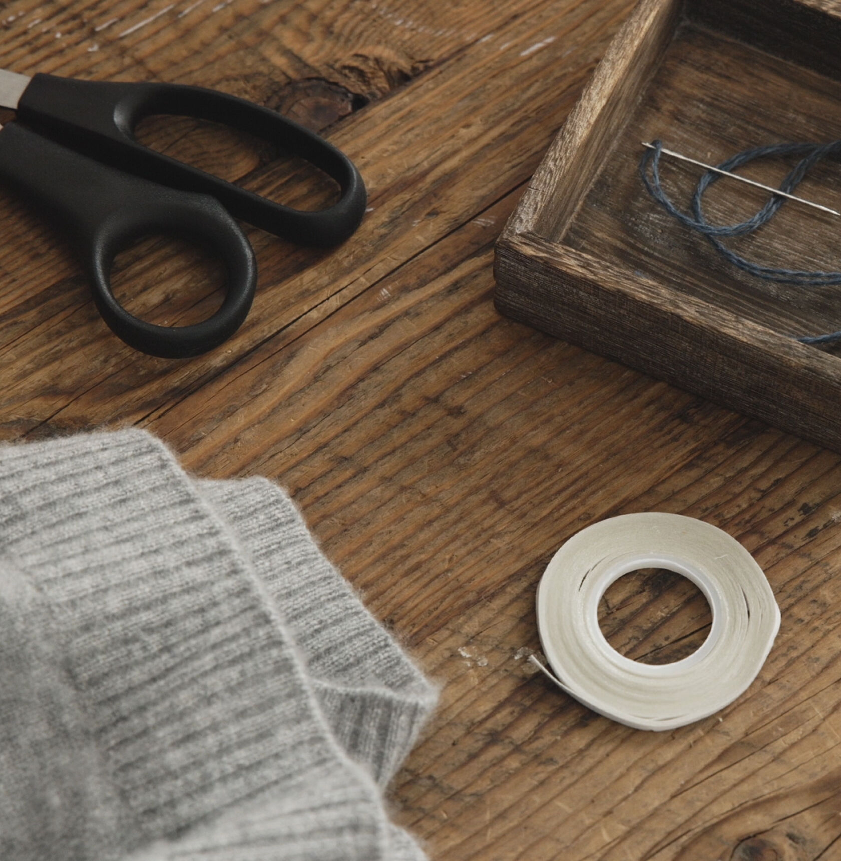 Thread, fabric tape, needle, and thread. Thread, fabric tape, needle, and thread.