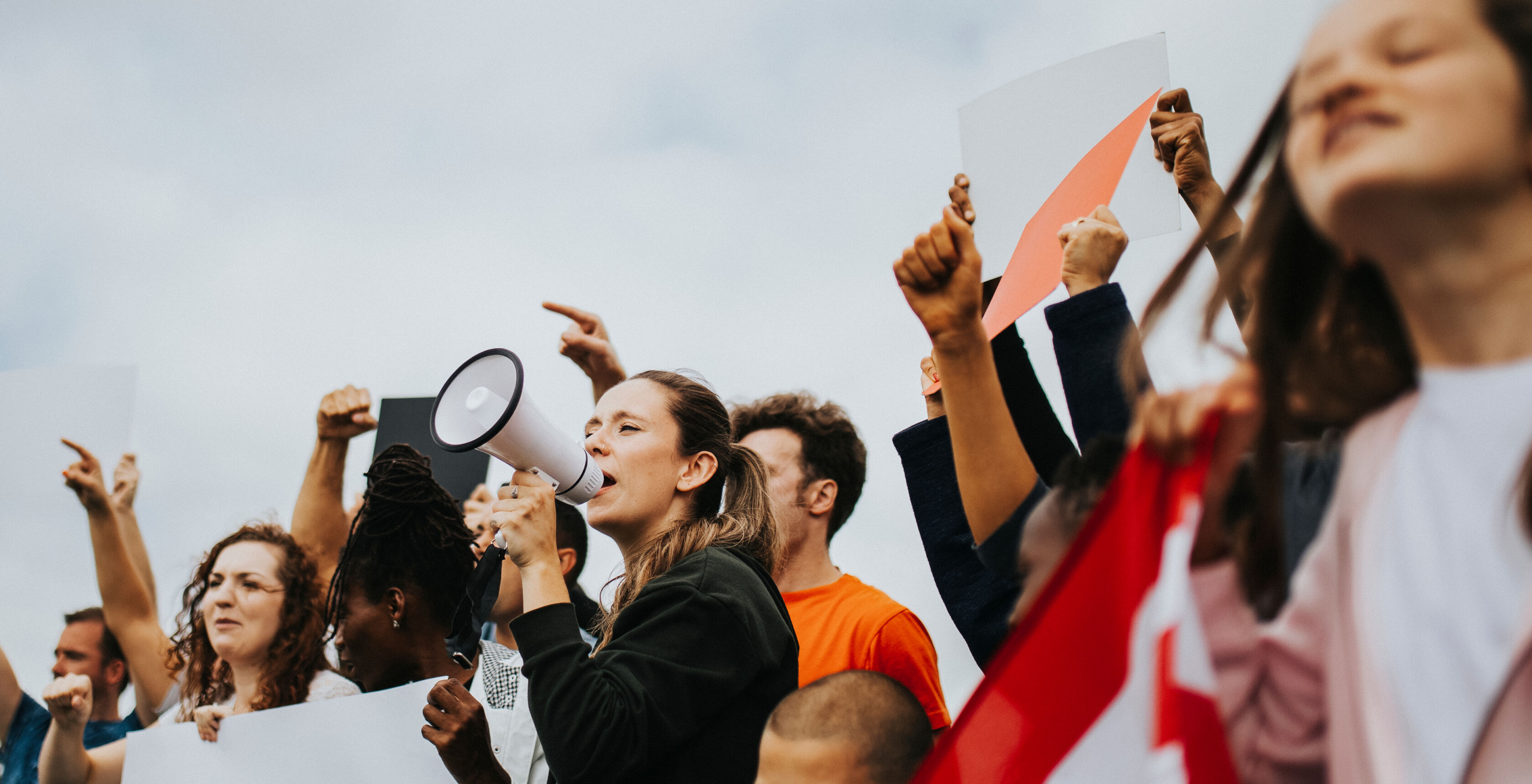 A group of people protesting. A group of people protesting.