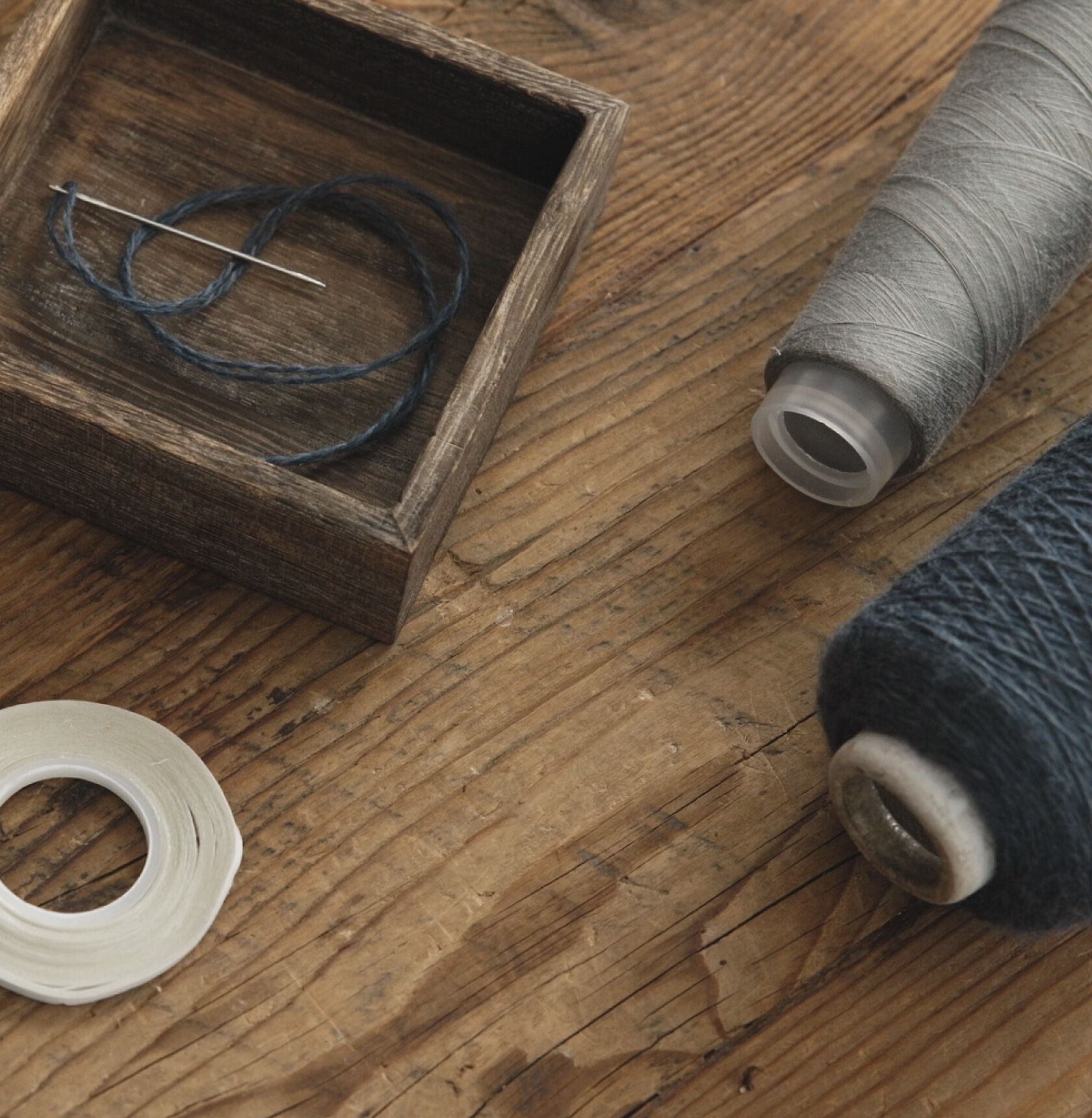 Gray and blue spools of thread. Gray and blue spools of thread.