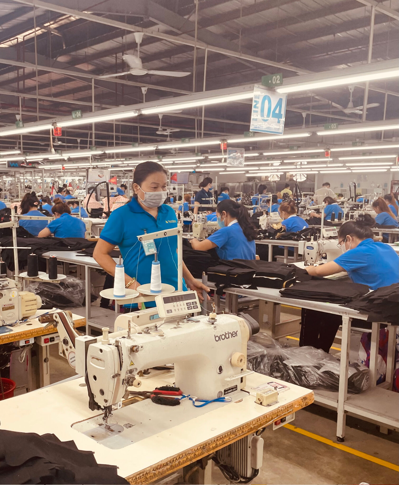 A sewing line at a garment factory. A sewing line at a garment factory.