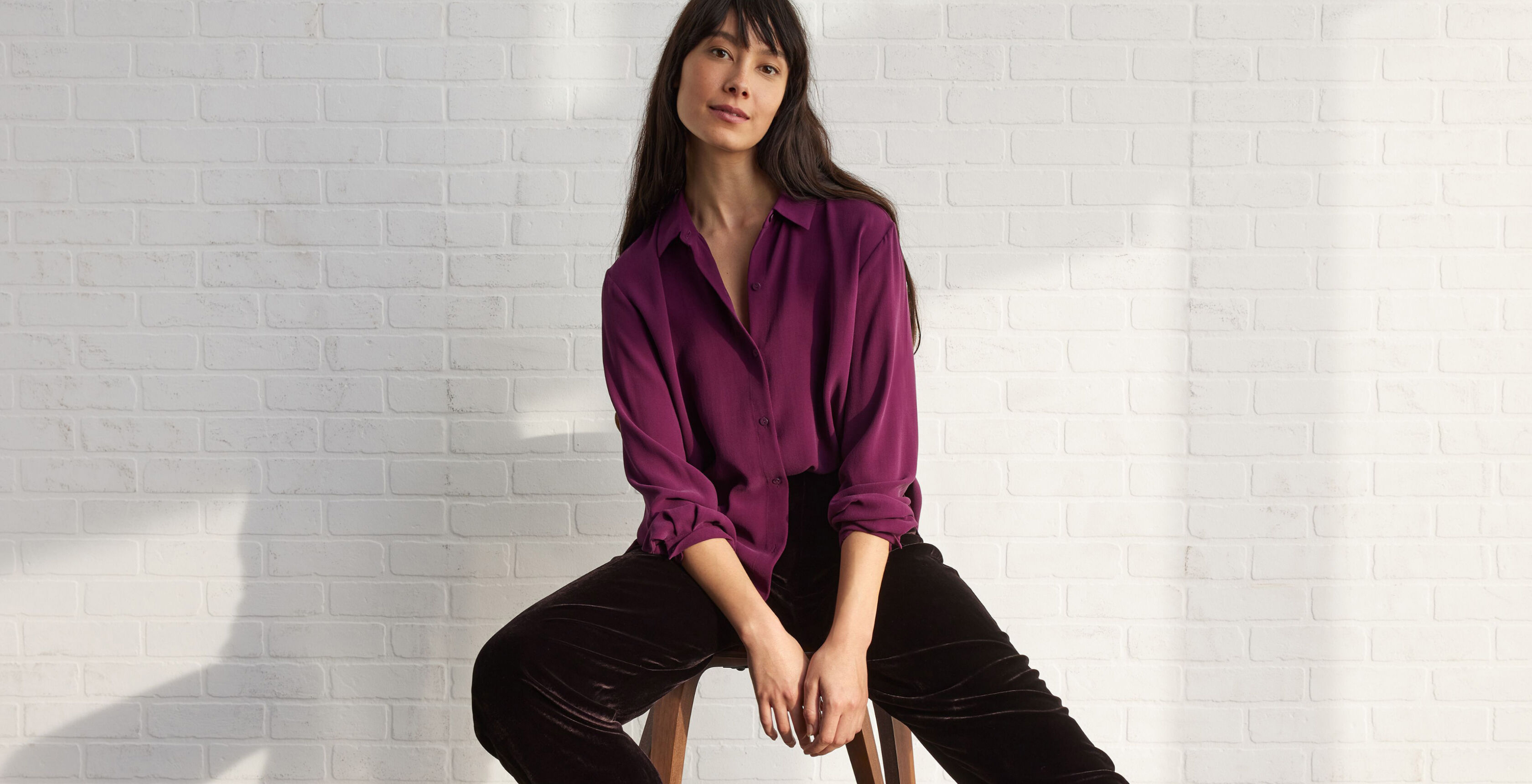 Woman wearing secondhand silk blouse. Woman wearing secondhand silk blouse.