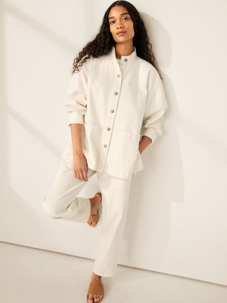 Woman wearing matching white shirt and pants. Woman wearing matching white shirt and pants.
