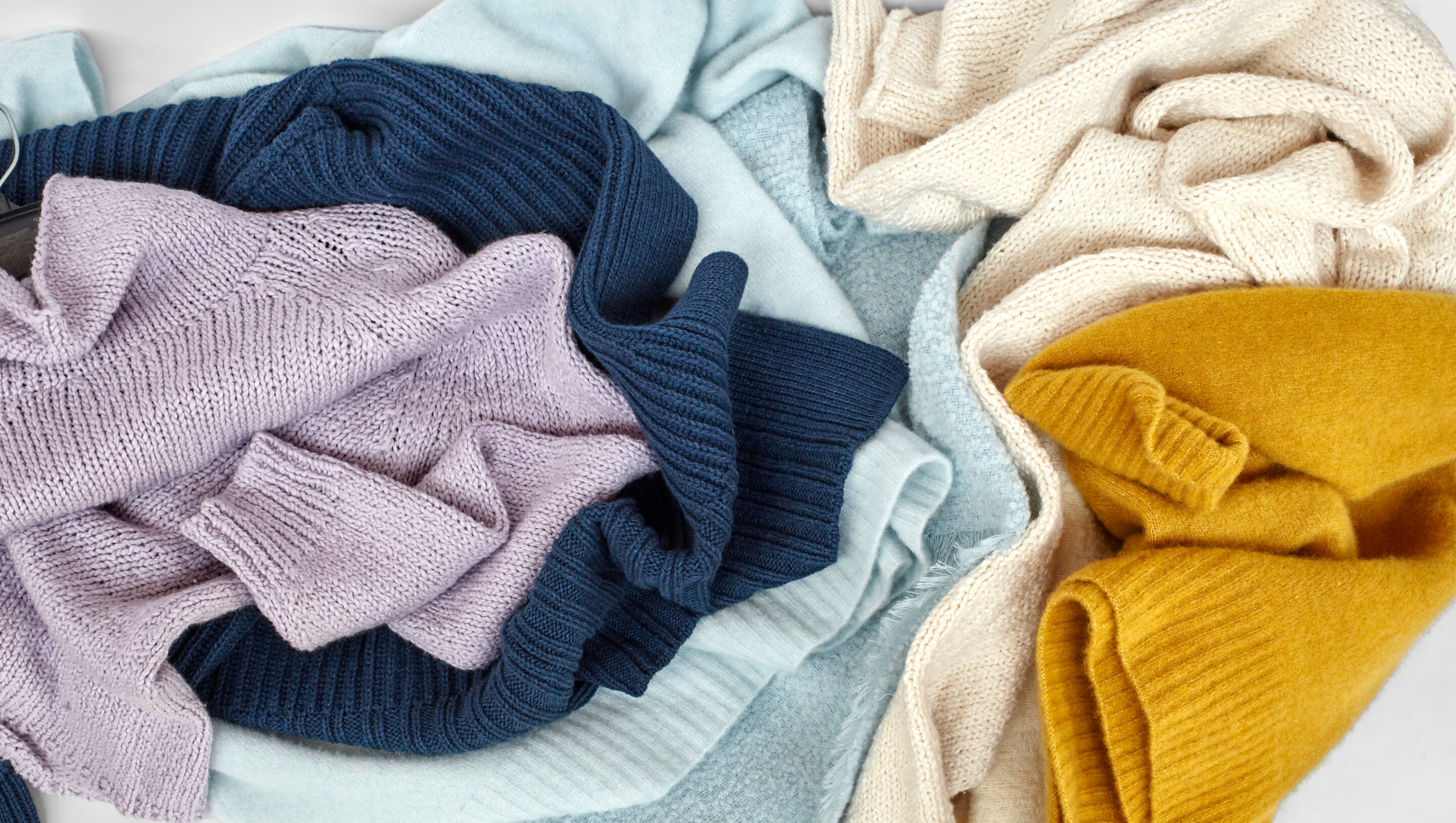 Colorful sweaters and knits shot from overhead. Colorful sweaters and knits shot from overhead.