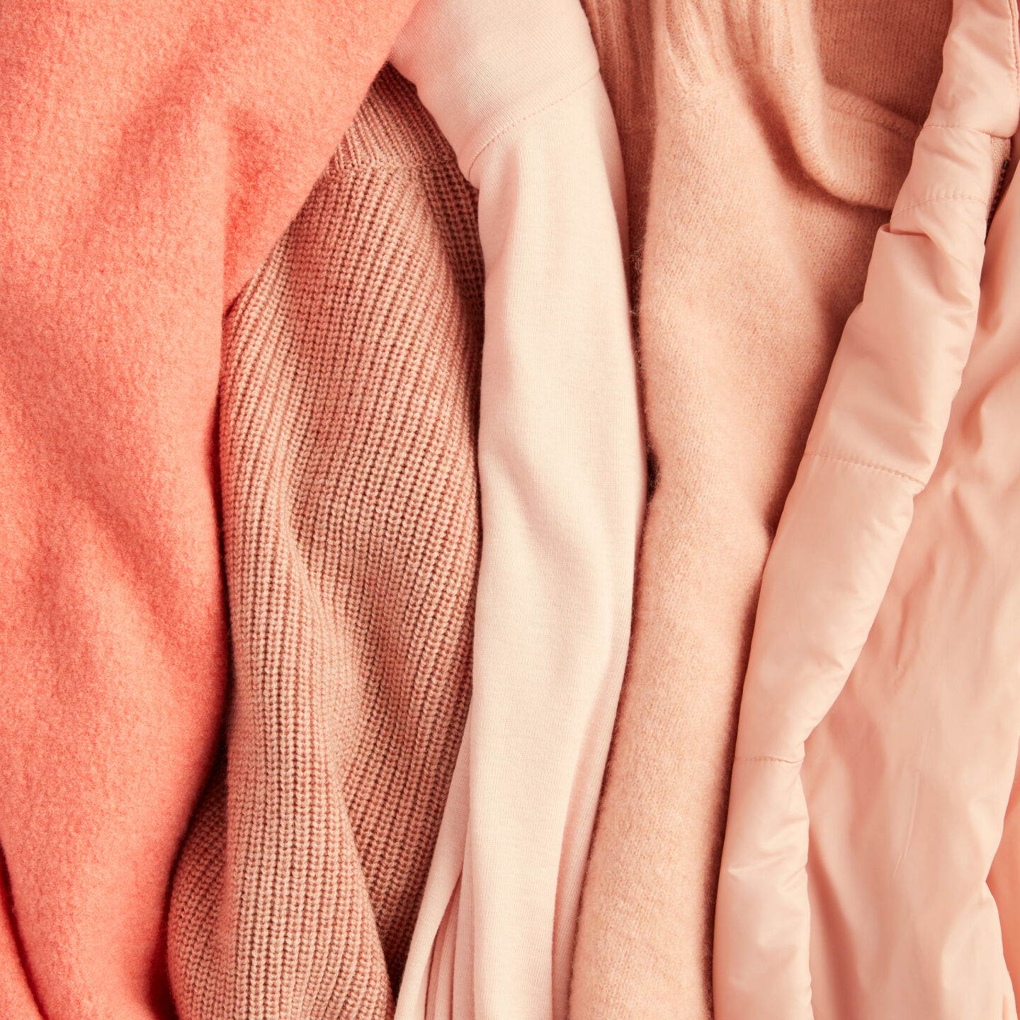 Peach colored sweaters and knits. Peach colored sweaters and knits.