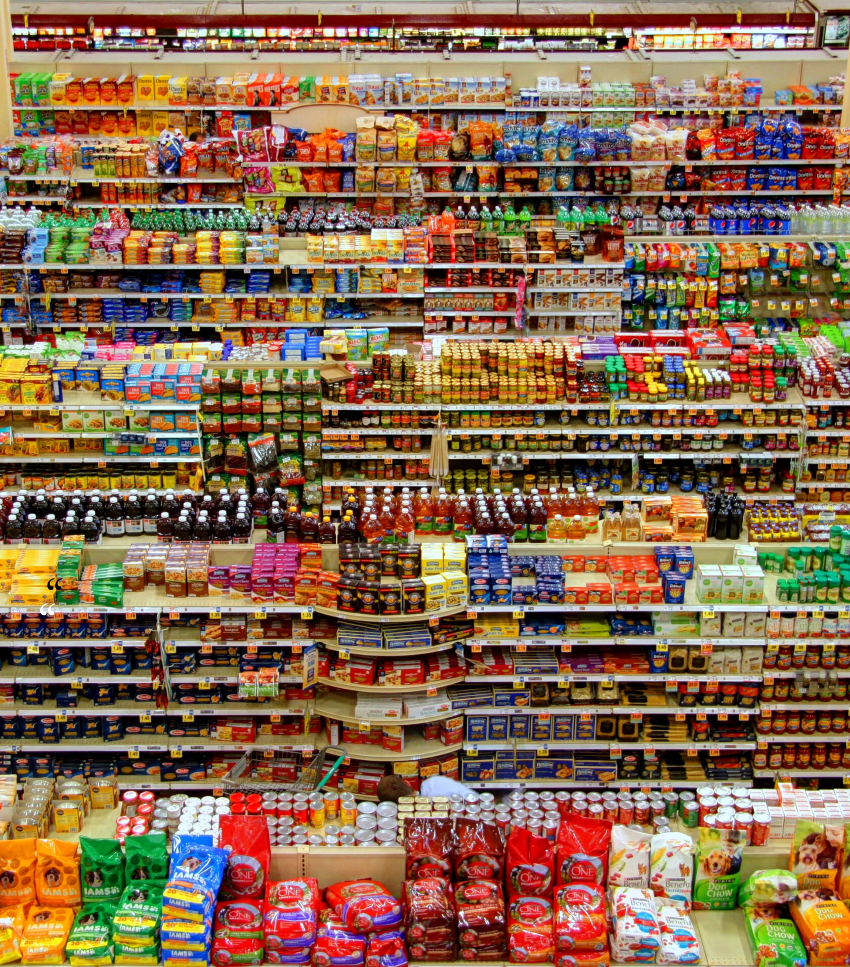 Grocery shelves stocked with packaged goods. Grocery shelves stocked with packaged goods.